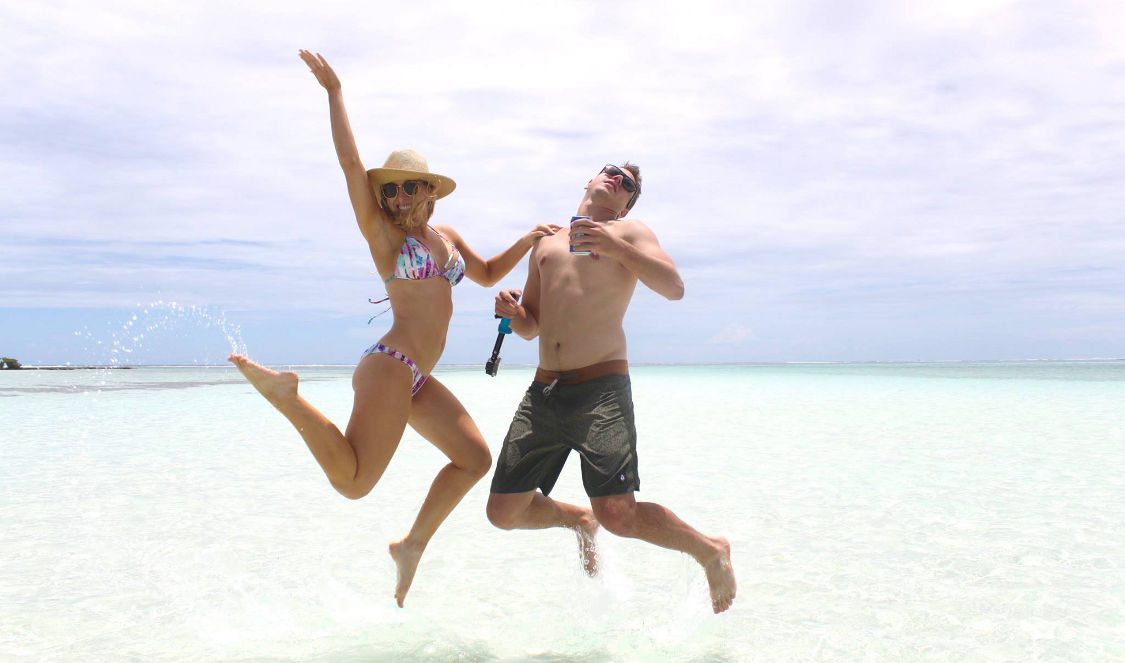 couple taking funny pics during lagoon tour in Moorea French Polynesia